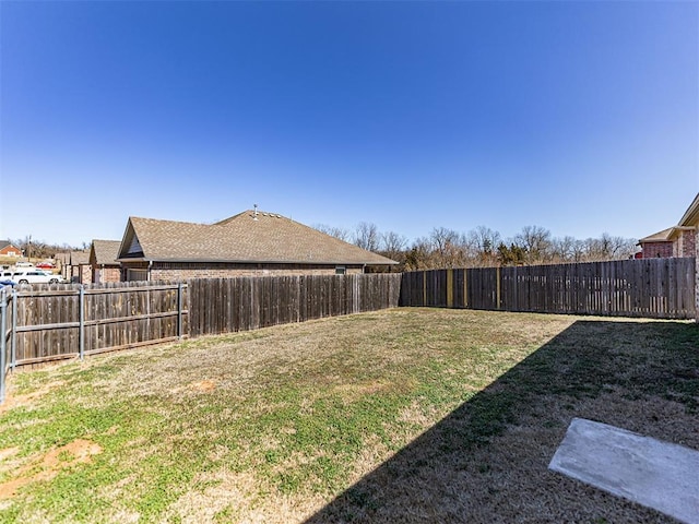 view of yard featuring a fenced backyard