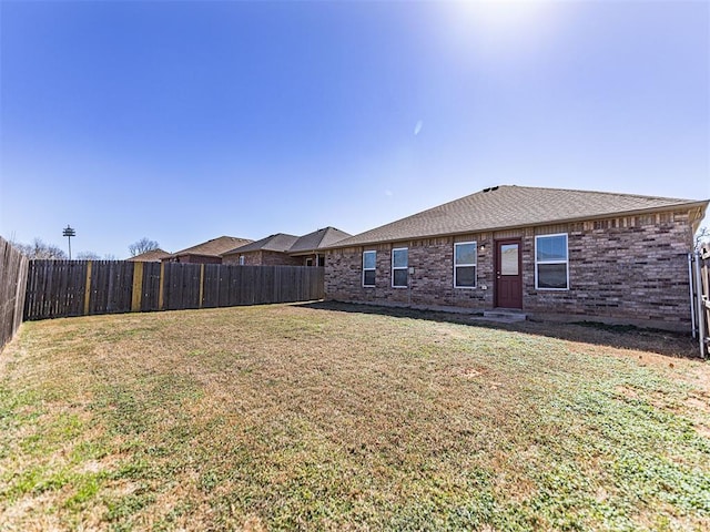 view of yard with a fenced backyard