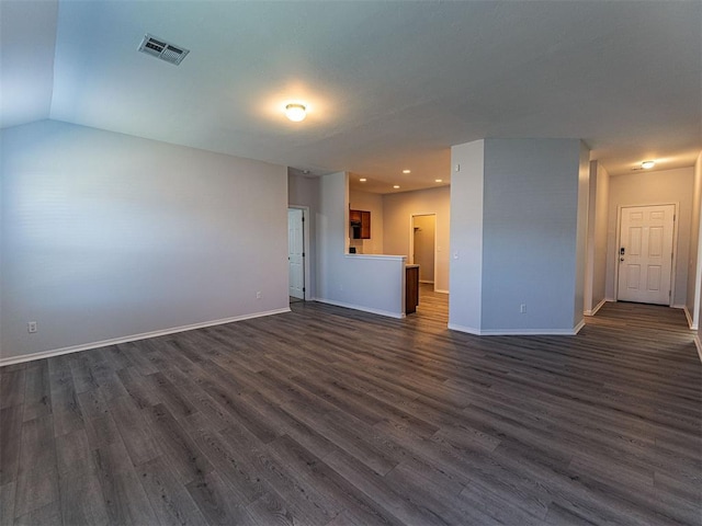 spare room featuring dark wood-style floors, baseboards, and visible vents