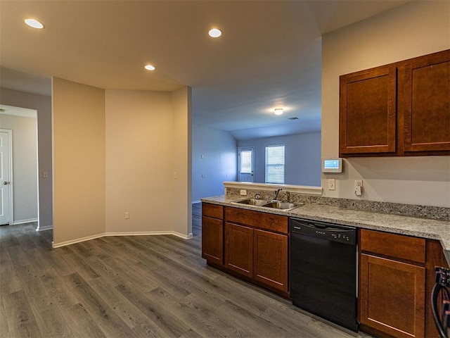 kitchen featuring black dishwasher, baseboards, dark wood-type flooring, a sink, and recessed lighting