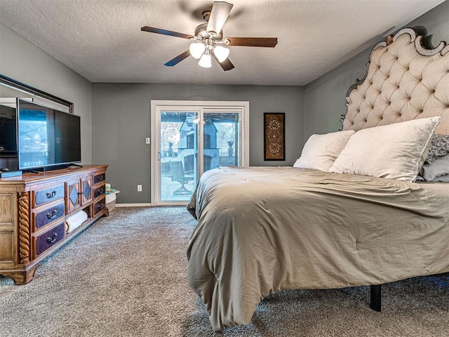 carpeted bedroom with access to exterior, a textured ceiling, baseboards, and a ceiling fan