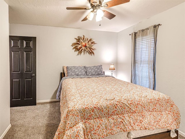 bedroom featuring a textured ceiling, carpet floors, a ceiling fan, and baseboards