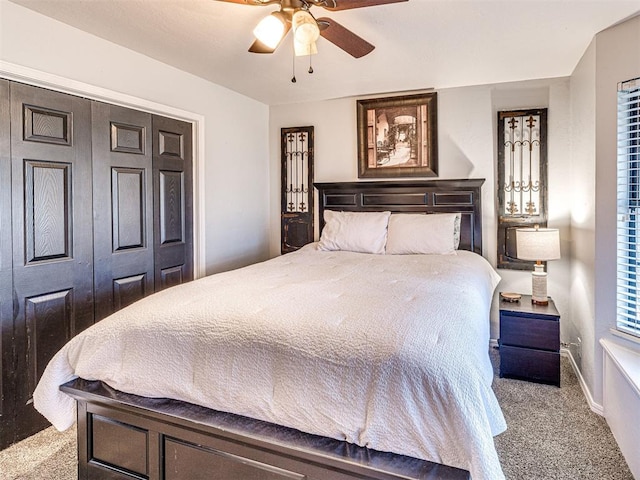 carpeted bedroom featuring a ceiling fan and baseboards