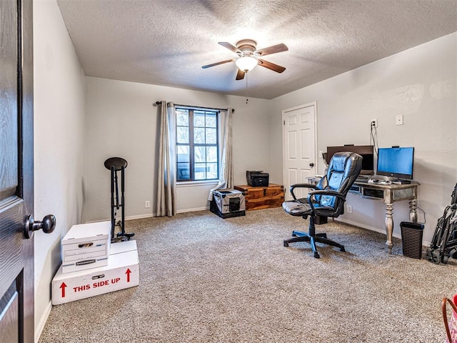 office space with ceiling fan, a textured ceiling, carpet flooring, and baseboards