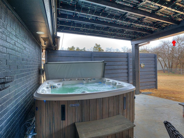 view of patio / terrace with a hot tub