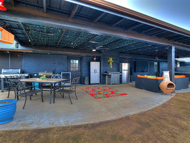 view of patio / terrace with outdoor dining area and a grill