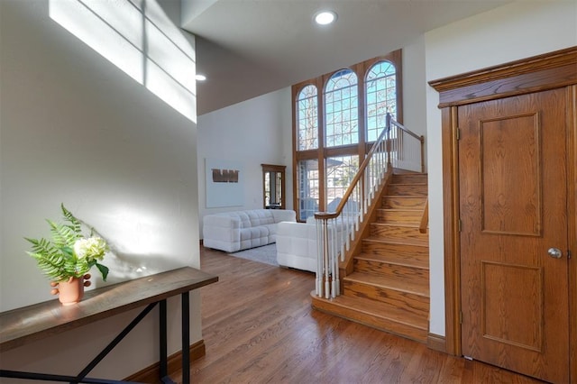 stairway featuring wood finished floors