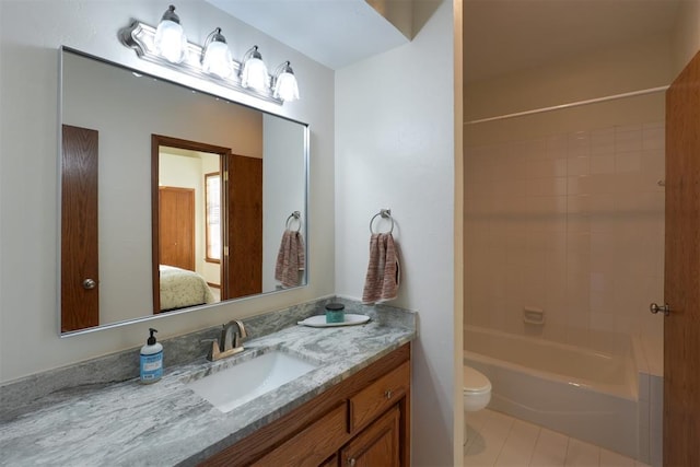 ensuite bathroom featuring toilet, shower / tub combination, connected bathroom, and vanity