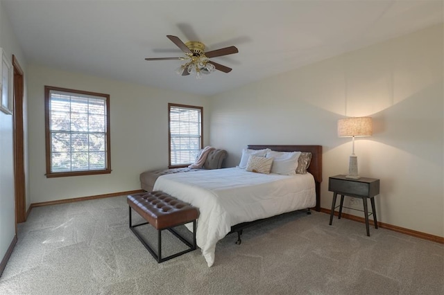 bedroom featuring a ceiling fan, carpet, and baseboards