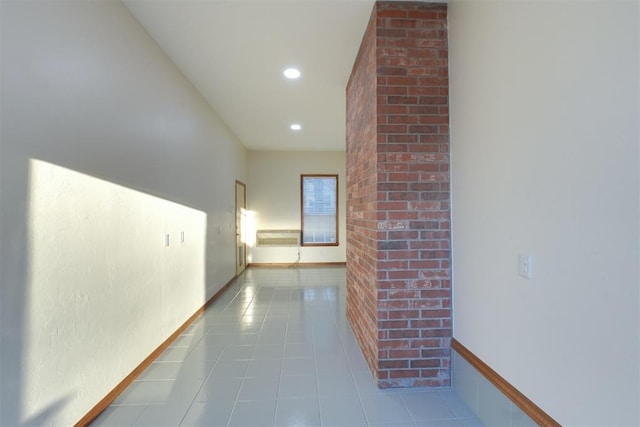 hallway with recessed lighting, baseboards, and tile patterned floors