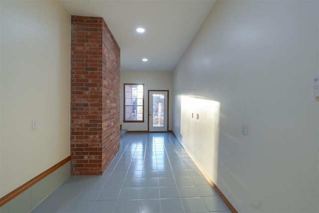 hallway with tile patterned flooring and recessed lighting