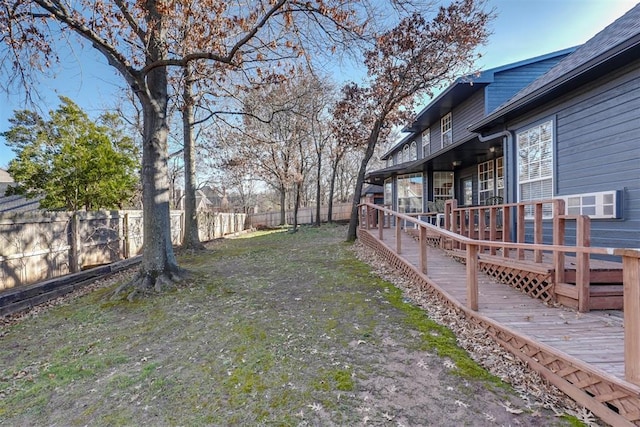 view of yard with a fenced backyard and a wooden deck