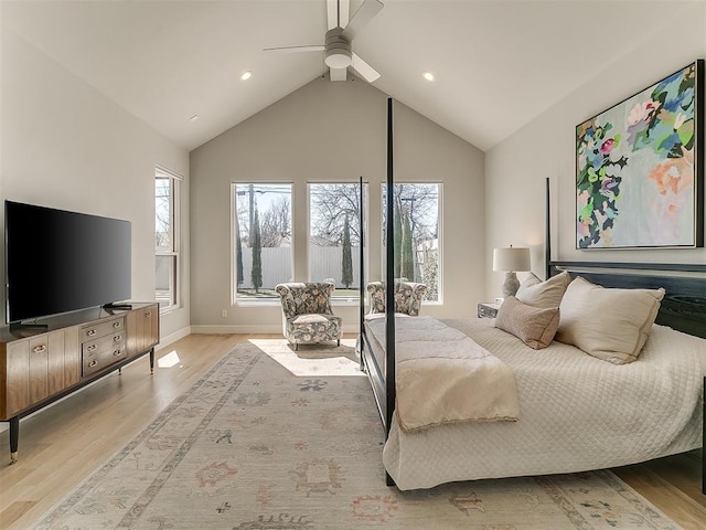 bedroom featuring high vaulted ceiling, wood finished floors, baseboards, and ceiling fan