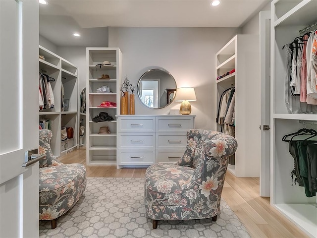 walk in closet featuring light wood-style floors