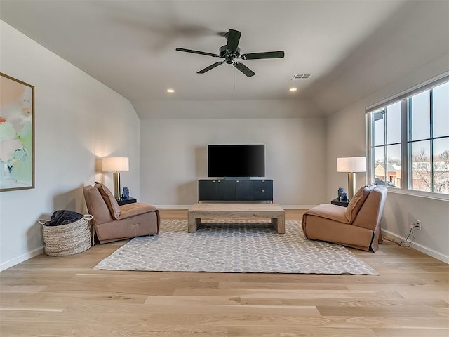 living area featuring recessed lighting, wood finished floors, visible vents, and baseboards