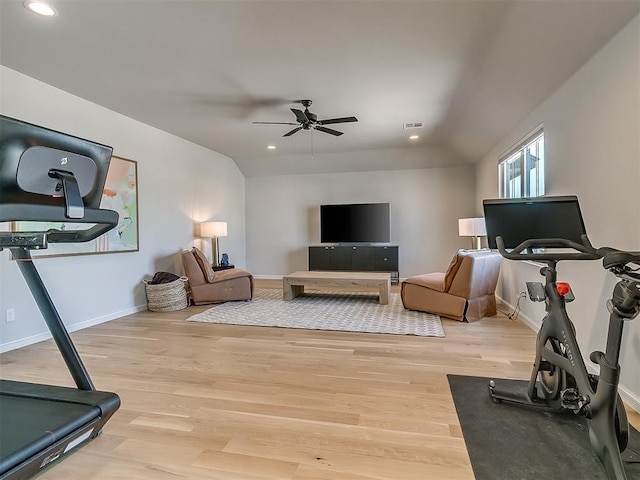 exercise area featuring recessed lighting, visible vents, baseboards, and light wood finished floors