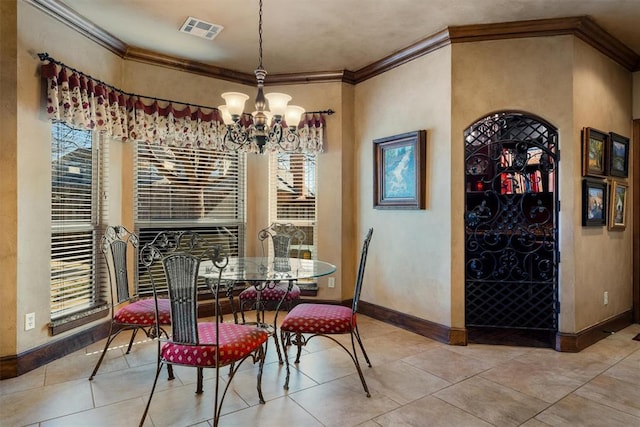 dining area with baseboards, visible vents, tile patterned floors, an inviting chandelier, and crown molding