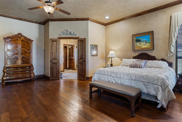 bedroom with ornamental molding, a ceiling fan, hardwood / wood-style flooring, and baseboards