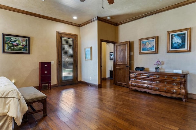 bedroom with a ceiling fan, crown molding, baseboards, and hardwood / wood-style floors