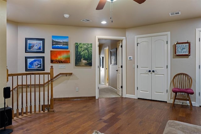 entrance foyer featuring wood finished floors, visible vents, and baseboards