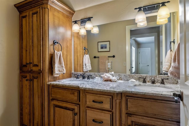 bathroom featuring double vanity and a sink