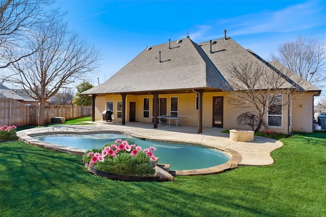 view of pool featuring a fenced in pool, fence, a lawn, and a patio