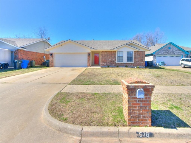 single story home featuring an attached garage, driveway, a front yard, and brick siding