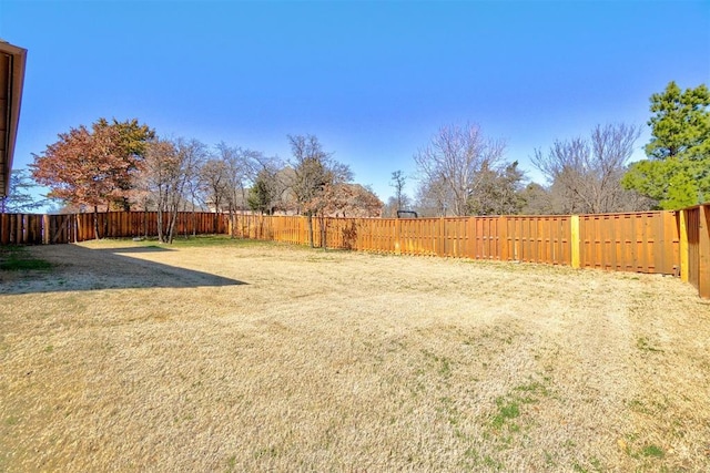 view of yard featuring a fenced backyard