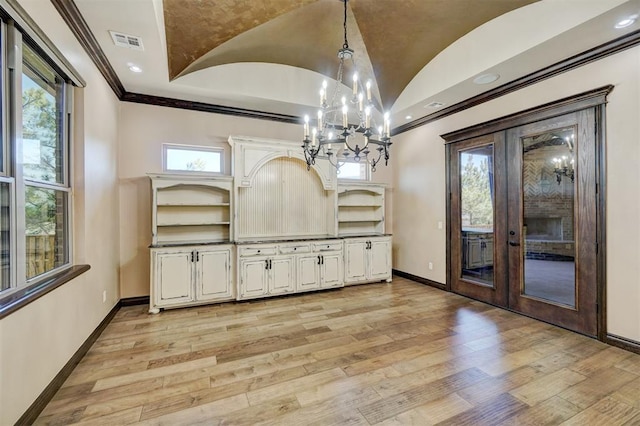 unfurnished dining area with light wood-style flooring, visible vents, and baseboards