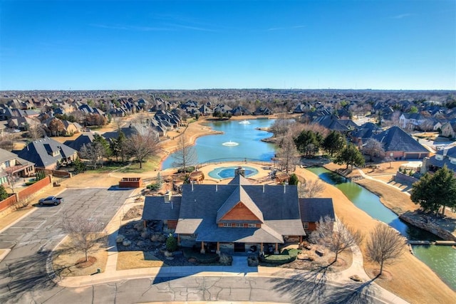 aerial view with a water view and a residential view