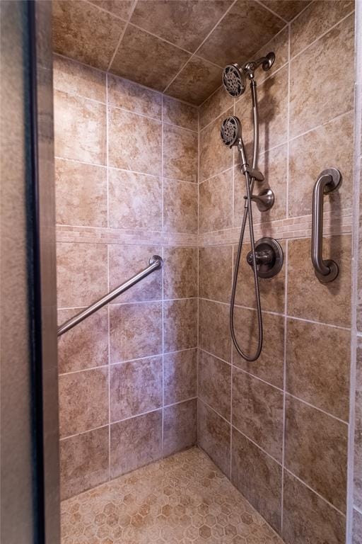 bathroom with tiled shower