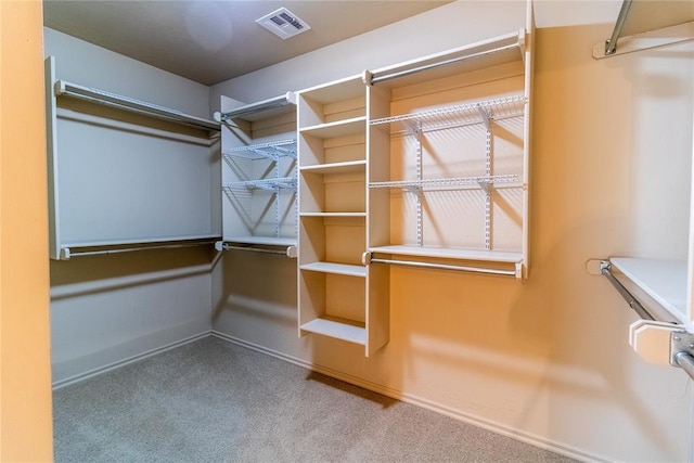 spacious closet featuring carpet floors and visible vents