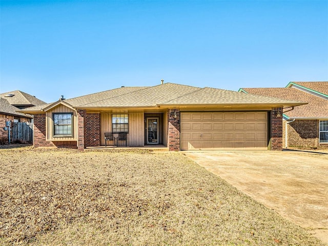 ranch-style home featuring a garage, concrete driveway, and brick siding