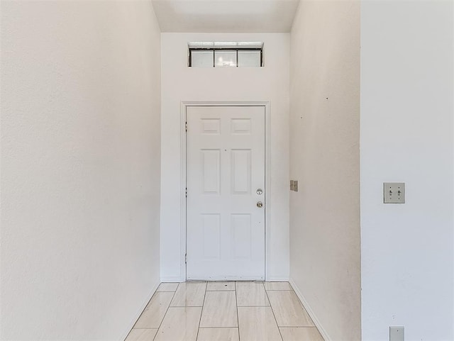 interior space featuring baseboards