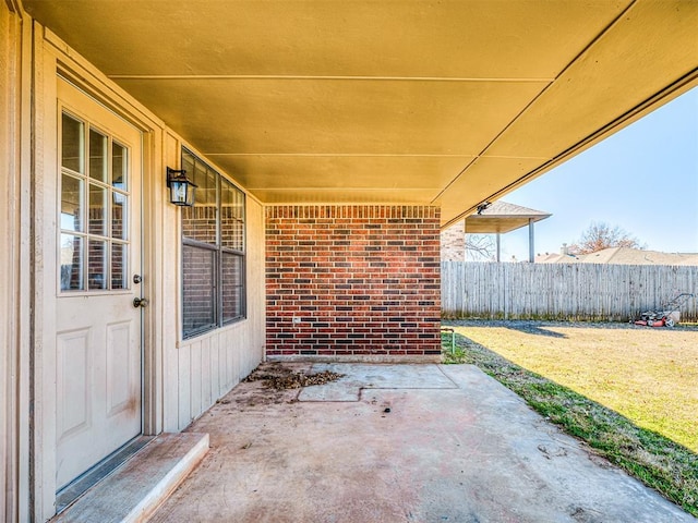 view of patio / terrace featuring fence