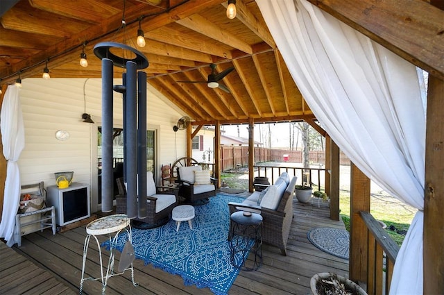 wooden deck featuring fence and an outdoor hangout area