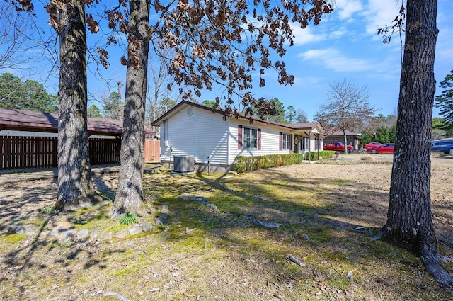 view of property exterior featuring fence