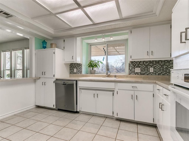 kitchen featuring a healthy amount of sunlight, visible vents, dishwasher, and a sink