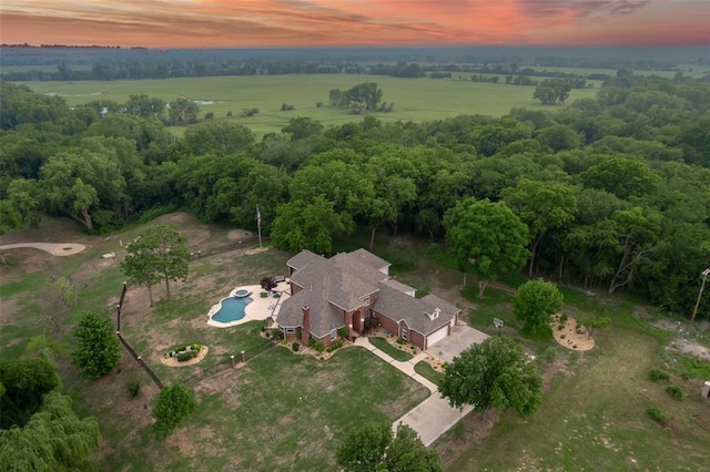 birds eye view of property with a rural view