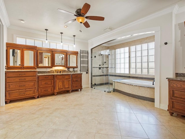 bathroom featuring a garden tub, visible vents, vanity, a shower stall, and crown molding