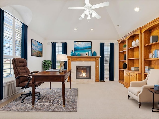 carpeted office space with lofted ceiling, recessed lighting, a fireplace, a ceiling fan, and radiator