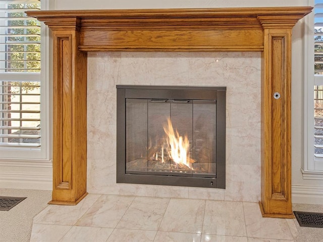 details with a premium fireplace and visible vents