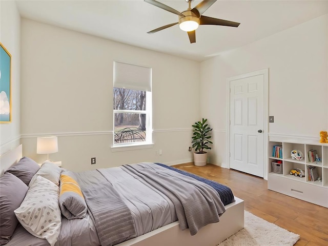 bedroom featuring a ceiling fan and wood finished floors