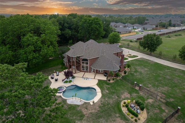 outdoor pool featuring a fenced backyard and a patio