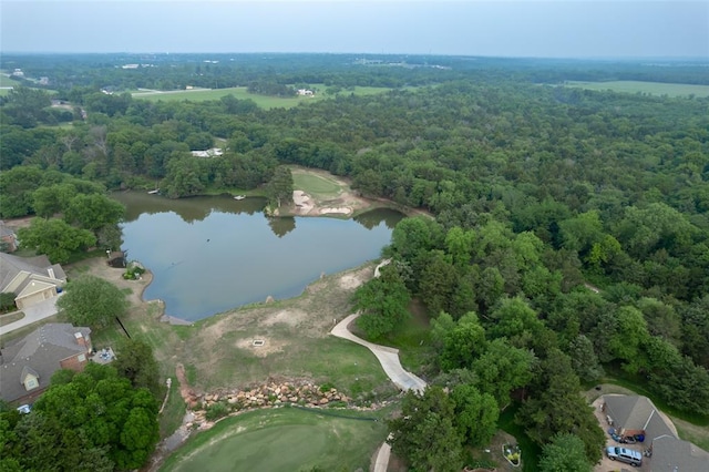 drone / aerial view with a water view and a wooded view