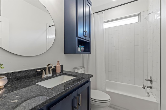 bathroom featuring toilet, shower / tub combo, and vanity