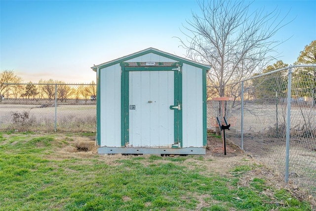 view of shed with fence