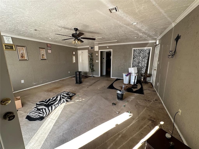 interior space with crown molding, visible vents, a textured wall, and a textured ceiling