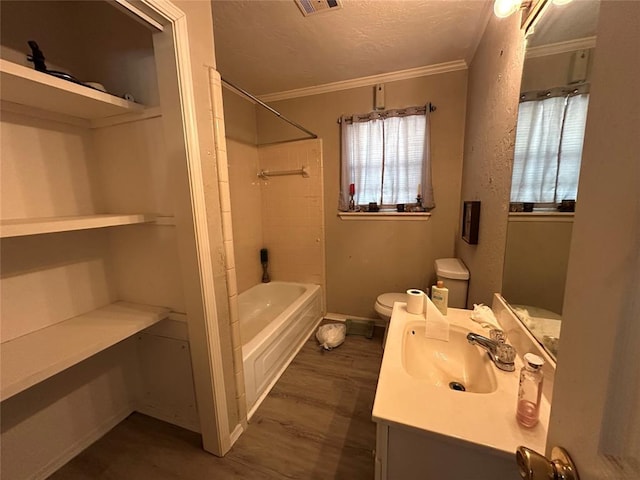 full bath with toilet, wood finished floors, crown molding, vanity, and a textured ceiling