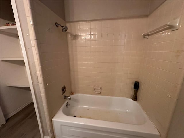 full bath with  shower combination and wood finished floors